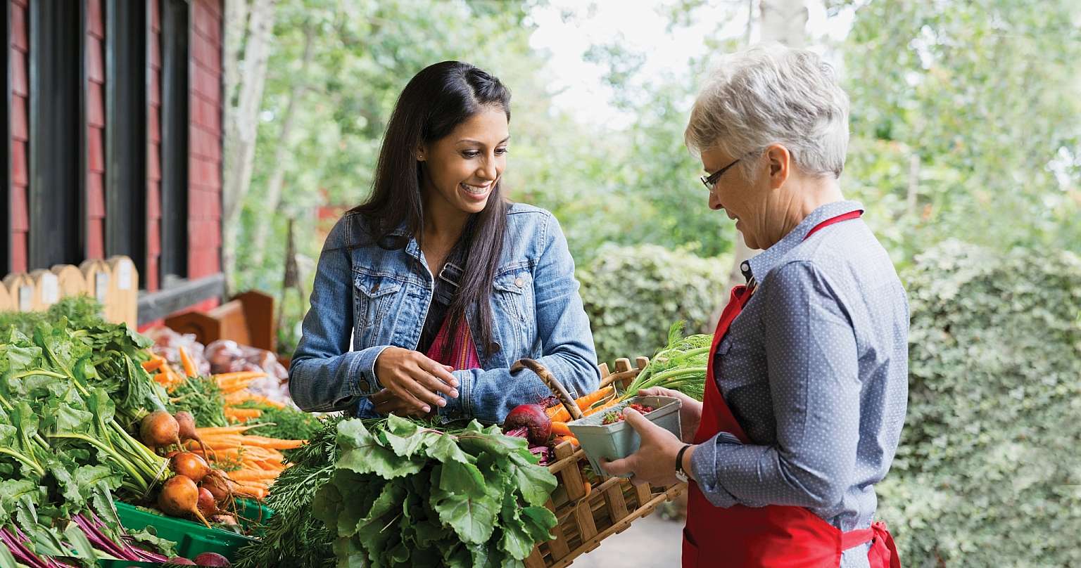 Women Talking at Vegetable Stand